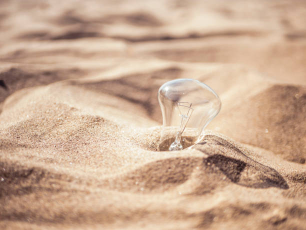 close up electric lighting lamp in the sand