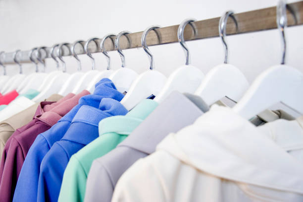 istock Colorful softshell coats on rack with hangers. 969485202