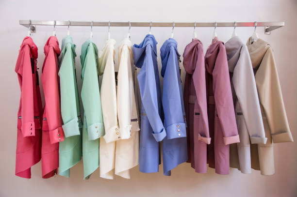 istock Colorful softshell coats on rack with hangers. 969485254