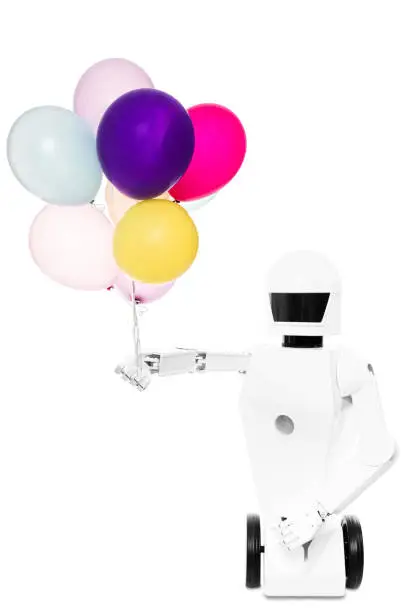 roboter toy with a lot of balloons in his hand, isolated in front of white background