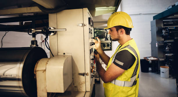 istock Electrician Examining Fusebox 969492428