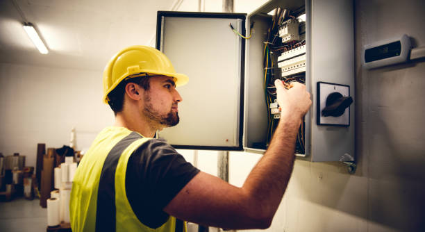 istock Electrician Examining Fusebox 969492460