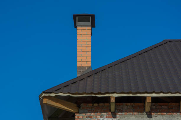 istock Modern brick chimney on the roof 969496600