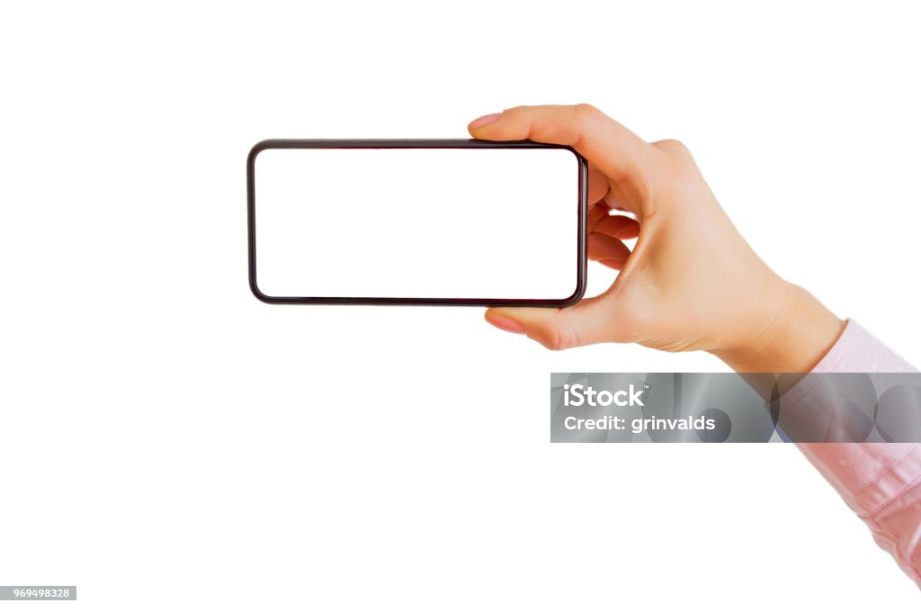 Person holding smartphone horizontally in one hand. Mobile app mockup. Person holding smartphone horizontally in one hand. Mobile app mockup for your design. Photographing Stock Photo