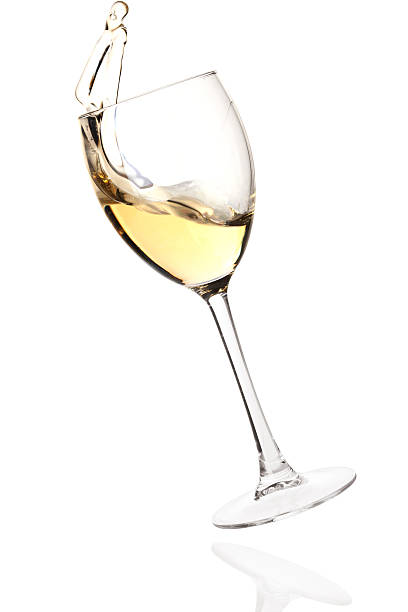 istock Splashing white wine in a falling glass 96950164