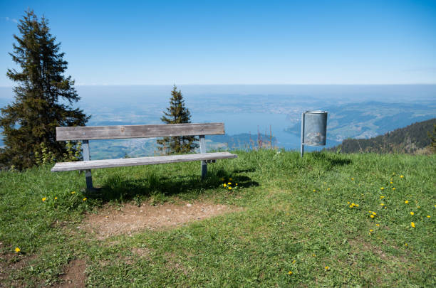 Chair and rubbish bin over looking zugersee on mount rigi