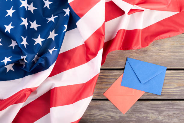 istock USA flag, red and blue envelopes. 969507420