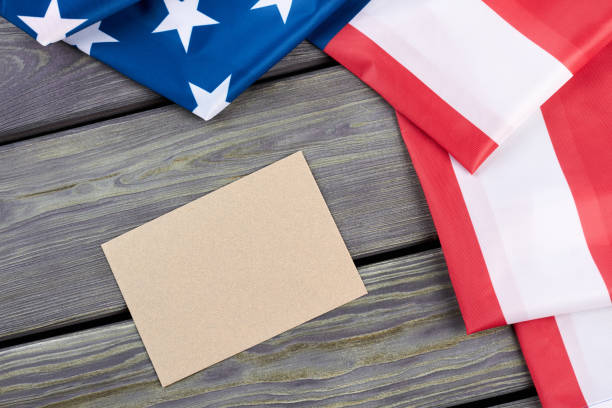 istock USA flag folded on wooden background. 969507814