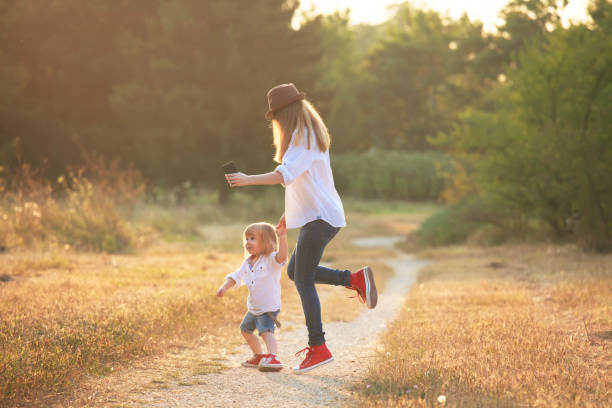 istock Little boy dancing and having fun with his mother 969510310