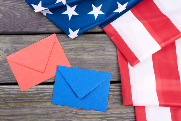 istock Folded USA flag and colorful envelopes. 969510418