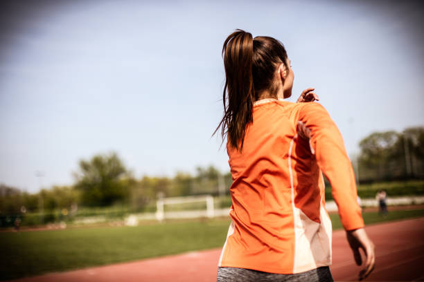 istock Close up image of woman running. Moving activity. 969510420