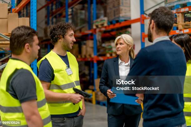 Meeting At Warehouse Stock Photo - Download Image Now - Warehouse, Manager, Meeting