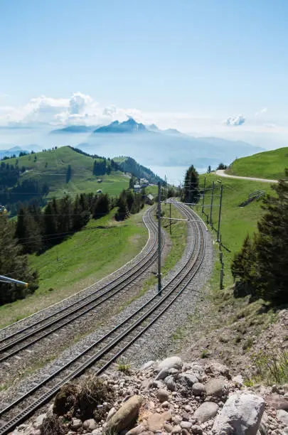 Train tracks (railway) on mount rigi to take guests from various stations to the peak of the mountain and back down.