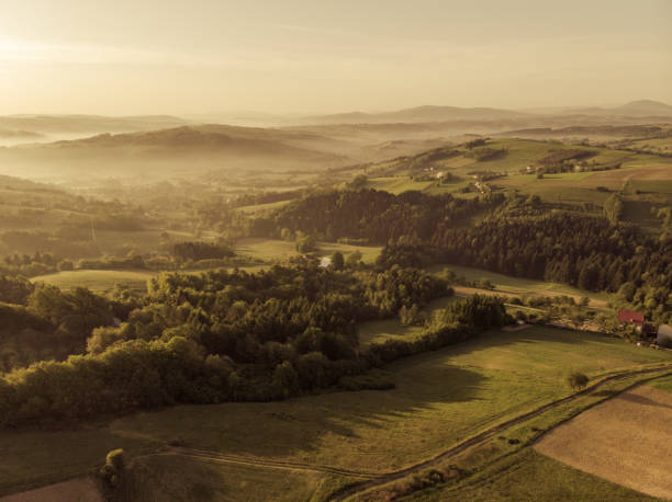 istock Beautiful aerial view over hills at sunrise 969514846