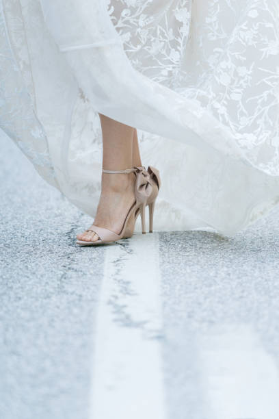 istock High heels sandals and wedding dress 969515582