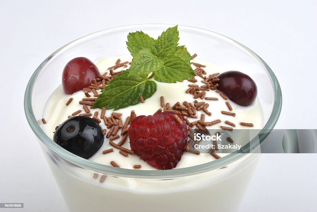 some organic blackberries in natural yoghurt and mint  Blackberry - Fruit Stock Photo