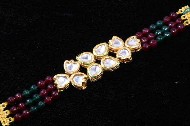 istock Fancy and colorful bracelet  jewelry macro image on black background 969522212