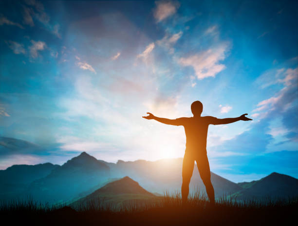 istock Happy man looking at wonderful mountains landscape at sunset 969522680