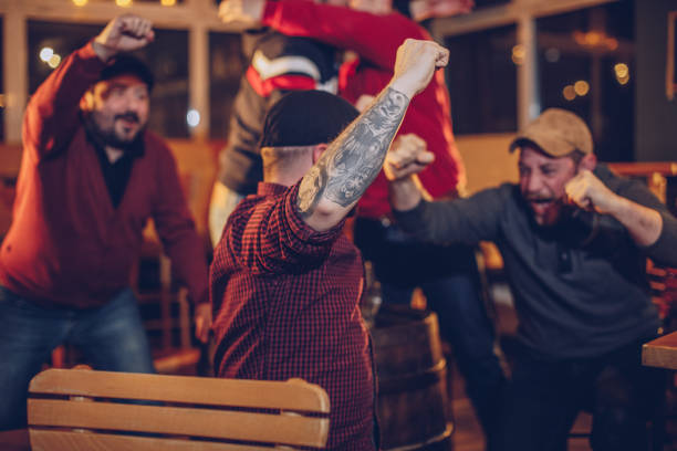 istock Cheerful fans in pub 969523386