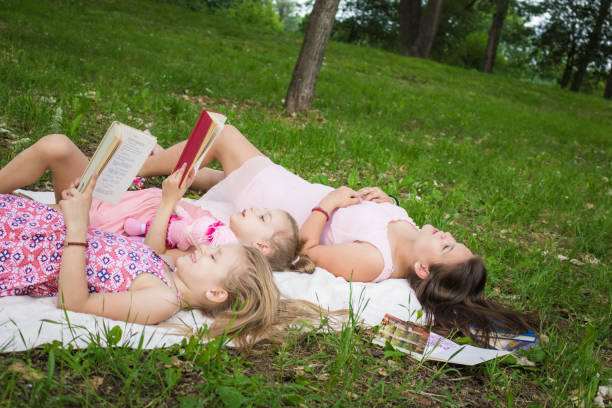 istock Three girls pending summer day in nature. 969528236