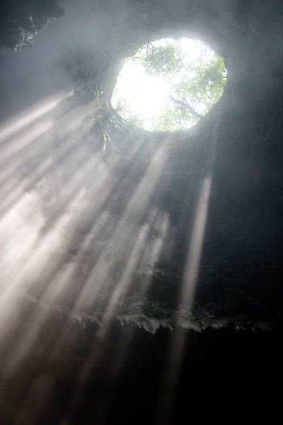 istock Sunlight through the cave hole at Jomblang cave 969528374
