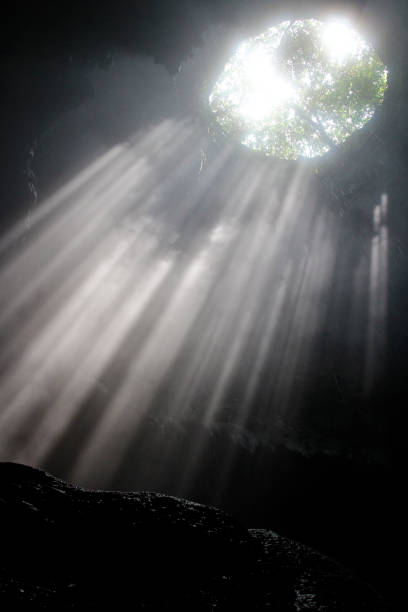 istock Sunlight through the cave hole at Jomblang cave 969528384