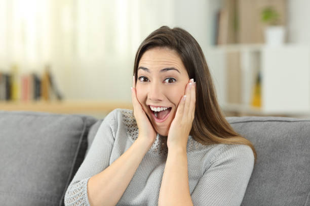 istock Surprised lady looking at you at home 969531662