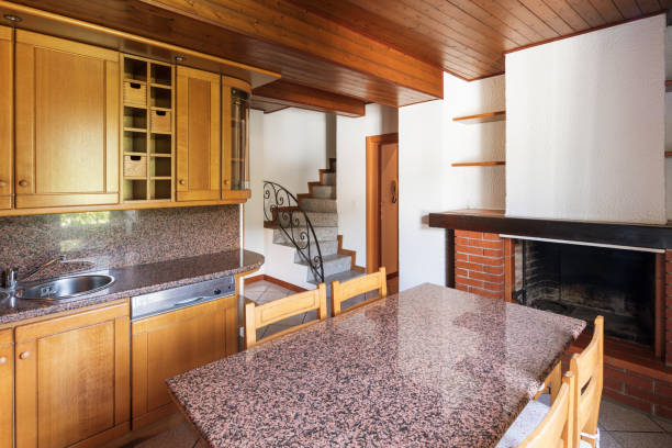 istock Kitchen with table and wooden furniture 969531938