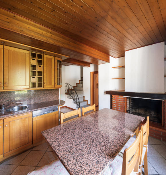 istock Kitchen with table and wooden furniture 969531988