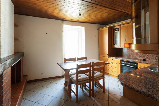 istock Kitchen with table and wooden furniture 969532174