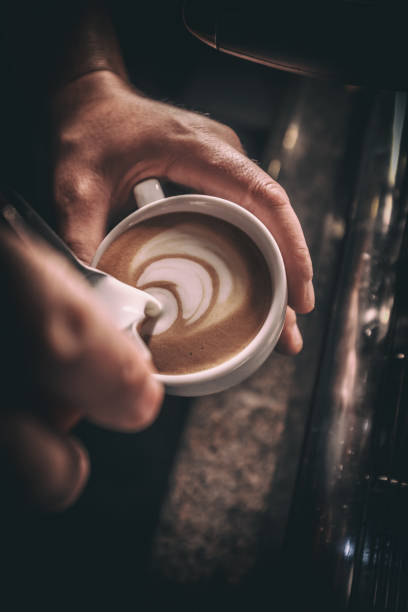 istock Barista pours milk 969532200
