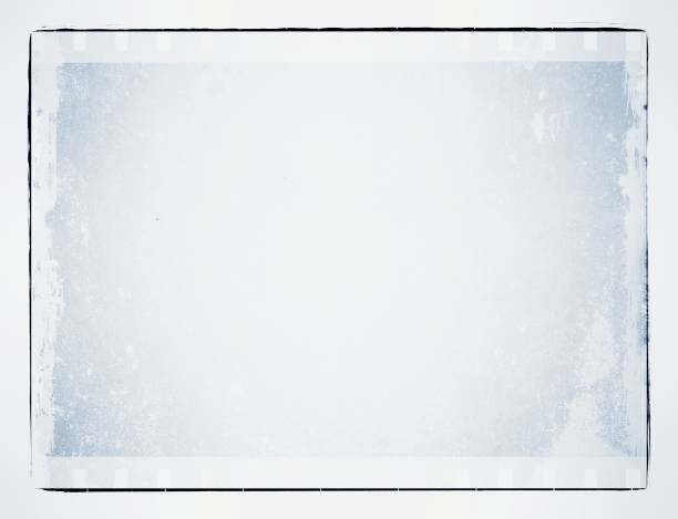 istock Grunge blue film strip frame with worn borders. 969535502