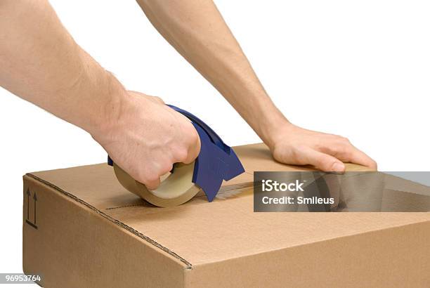 Preparing A Packet Stock Photo - Download Image Now - Adhesive Tape, Box - Container, Brown