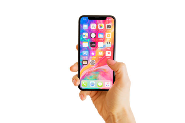 Riga, Latvia - March 15, 2018: Home screen of the latest generation iPhone X. iPhone X is a smartphone designed, developed, and marketed by Apple Inc. It was announced on September 12, 2017.