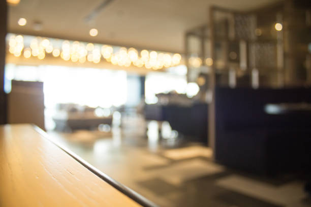 istock Blurred interior design with bright white lighting and hanging lights in cafe or restaurant. 969539782