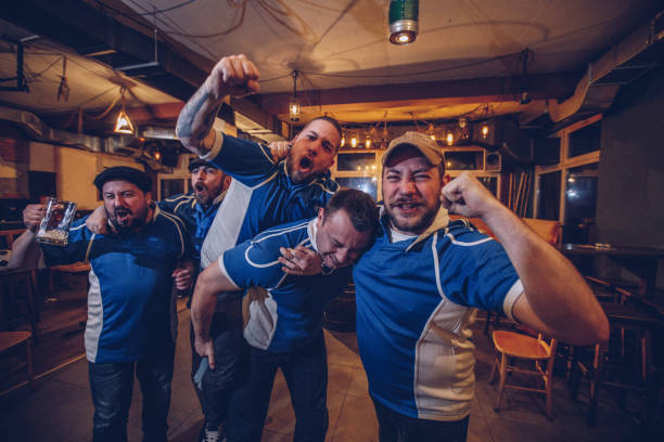 istock Cheerful sport fans in pub 969543220