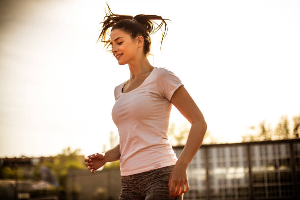 istock Image of young woman running. 969545836