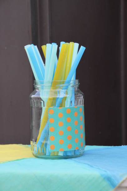 istock Colorful blue and yellow drinking straws for beverages 969545874