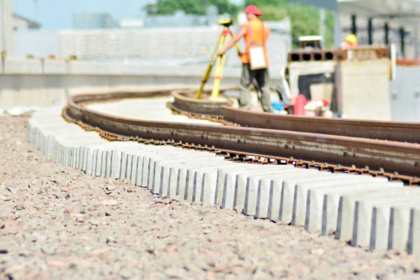 istock Railway Workers repairing railway on hot summer day 969549816