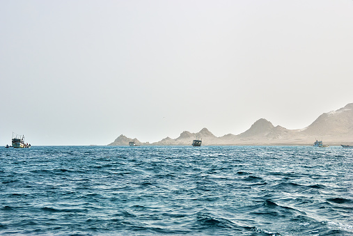 Socotra island, Yemen. Fishing boats shown in the Gulf of Aden, Arabian Sea at dawn