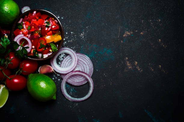 istock Tex-Mex Concept, Salsa Sauce, Tomatoes, Red Onion and Lime 969550242