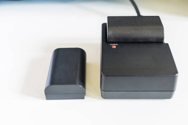 istock Camera battery is changing on Battery charger. 969550256