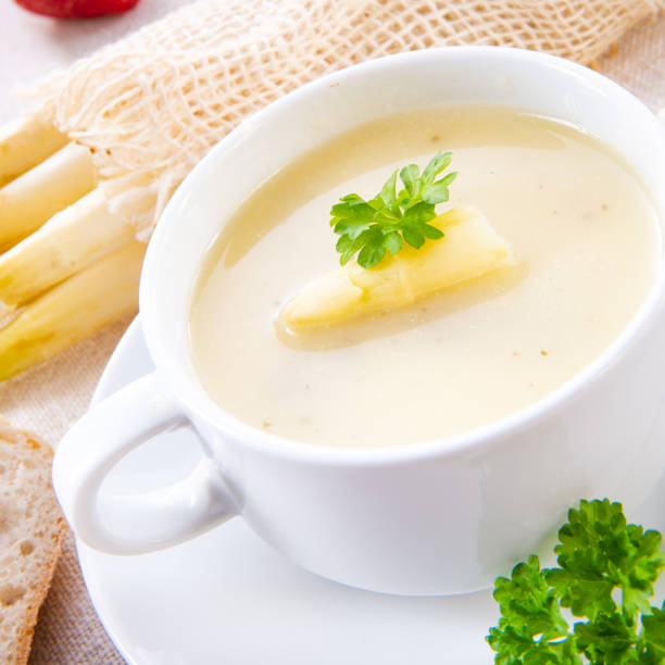 istock asparagus cream soup with capers and fresh baguette 969550276