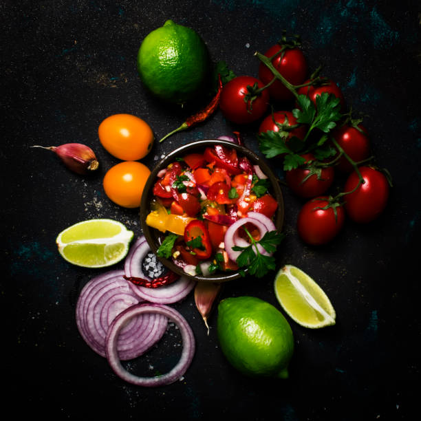 istock Tex-Mex Concept, Salsa Sauce, Tomatoes, Red Onion and Lime 969550428