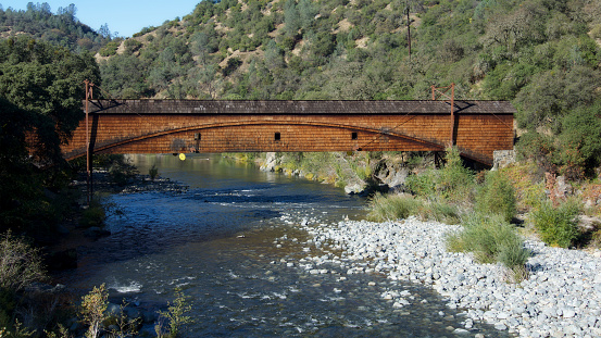 Side view of the bridgeport Covered Bridge at South Yuba River in California, USA. This bridge has the longest clear span of any surviving covered bridge in the world