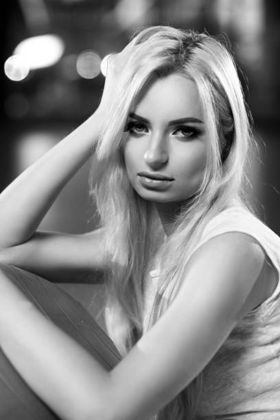 istock Beautiful blonde woman with gray exercise ball 969555538