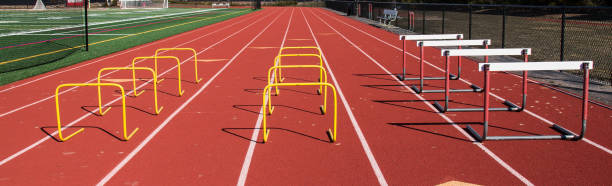 istock Track set up with hurdles for jumping over 969555628