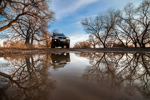 KHABAROVSK, RUSSIA - APRIL 13, 2017: Mitsubishi Pajero Sport at a big puddle