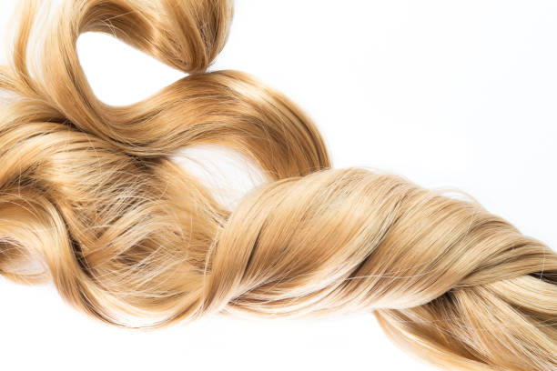 istock long blond wavy twisted hair on white background 969564200