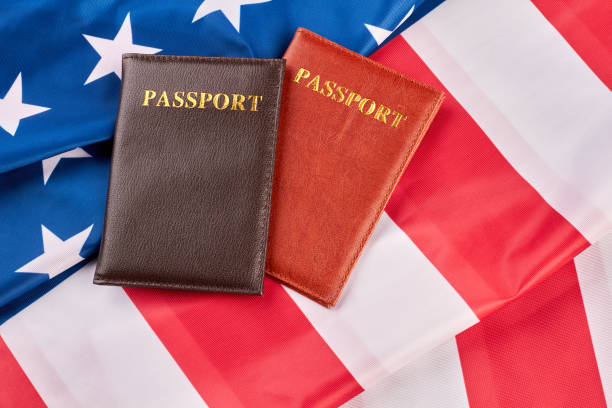 istock Close up two passports on American flag. 969568130